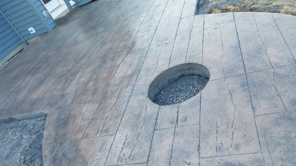 Stamped concrete patio with a built-in fire pit